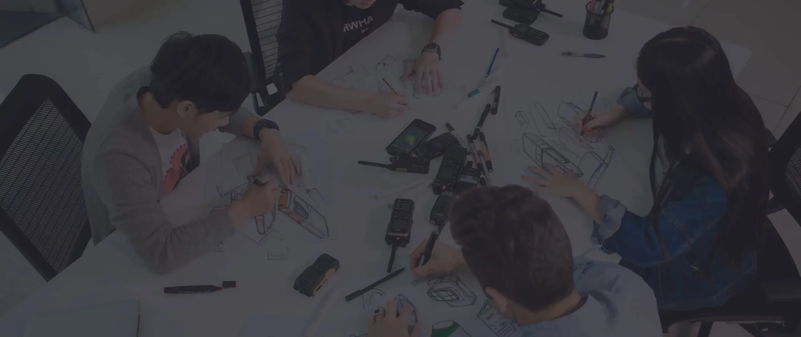 A team gathering around a table in a collaborative work setting